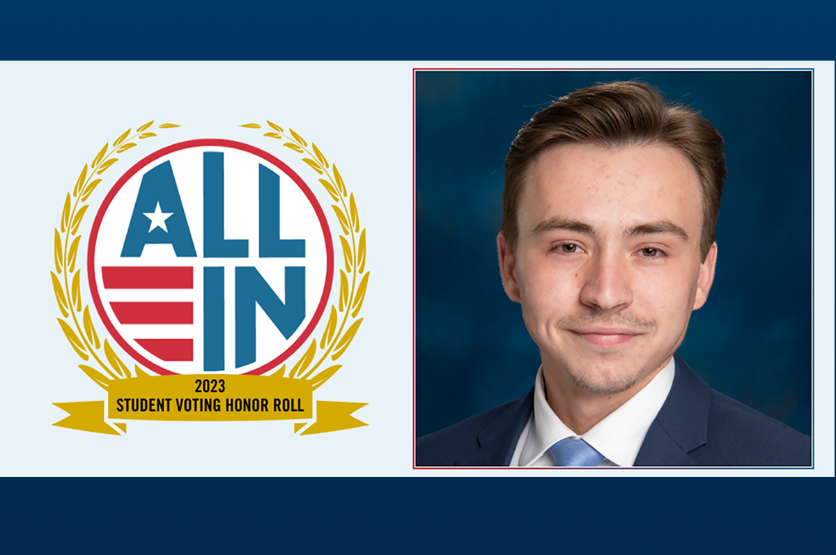 photo of student beside badge